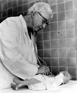 Virginia Apgar monitoring a baby
