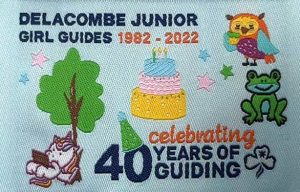 Badge with cake, frog and unicorn