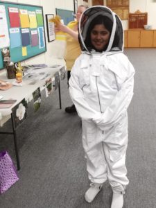 Girl dressed in bee protection