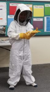 Girl dressed in bee protection