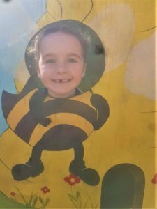 Girls face in bee cutout