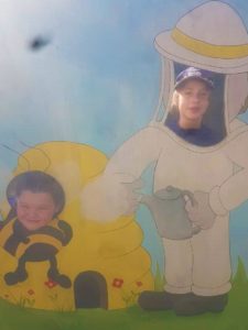 Girls faces in bee cutout