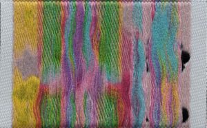 Cotton threads on badge backing