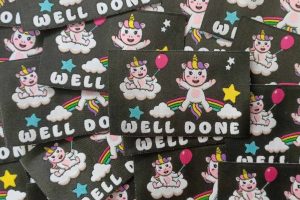 Unicorns with balloon and rainbow